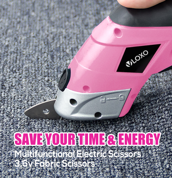 Pink cordless fabric scissors cutting fabric